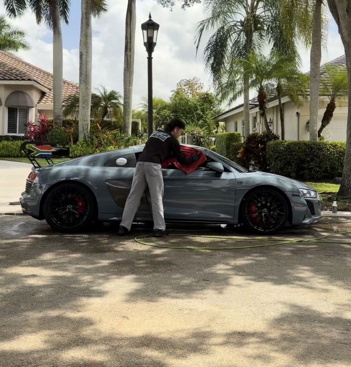 William detailing an Audi R8 in Miami